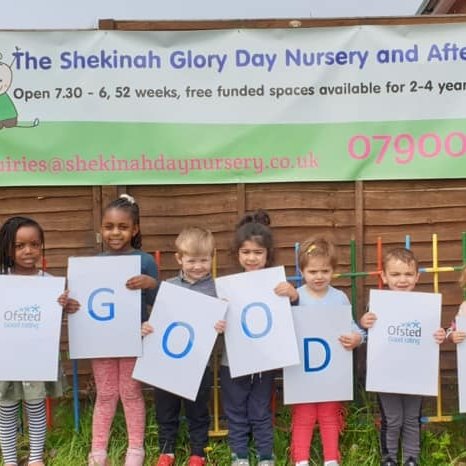 Children exploring the outdoor garden, sandpit and climbing frames